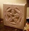 Petersen carved in stone